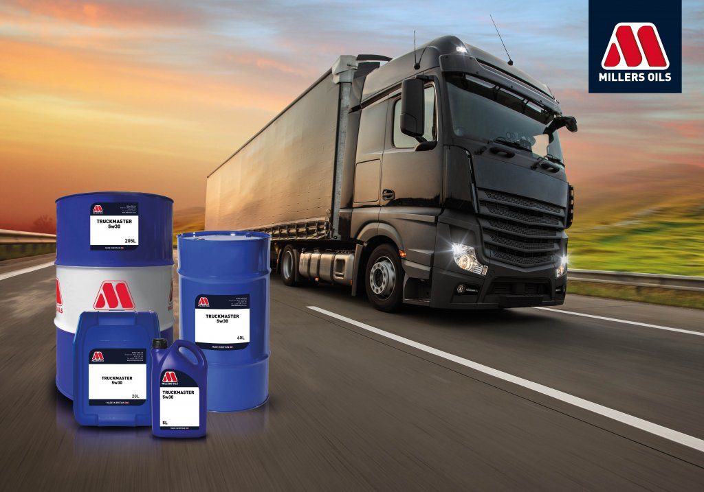A lorry on a motorway with our products on the side and the Millers Oils logo top right