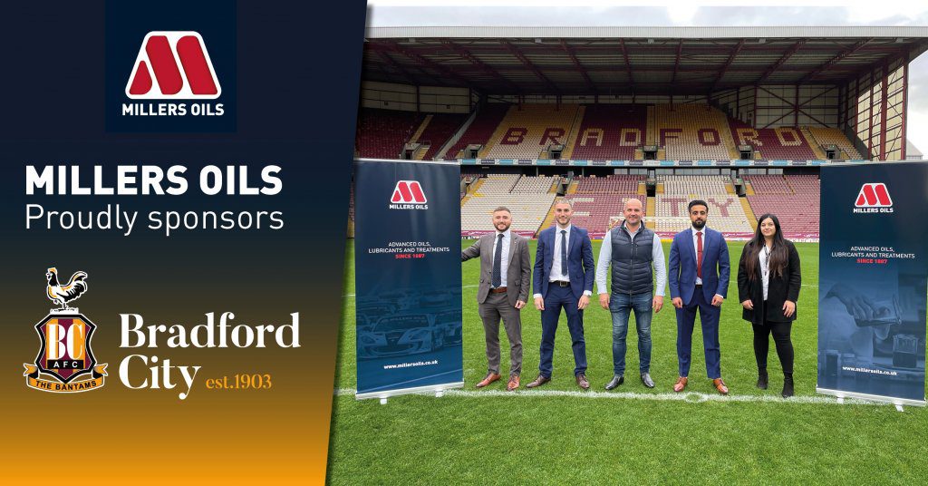 Millers Oils logo and Bradford City football Club logo with members from both teams on the pitch