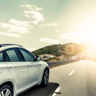 Passenger car driving on the road