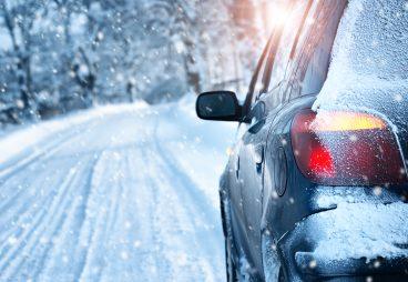 Car driving in snowy weather