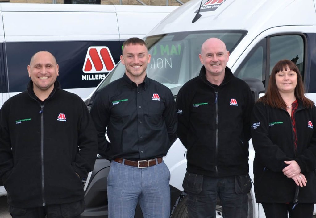 Image of Millers Oils Fluid Management team stood in front of 2 vans.